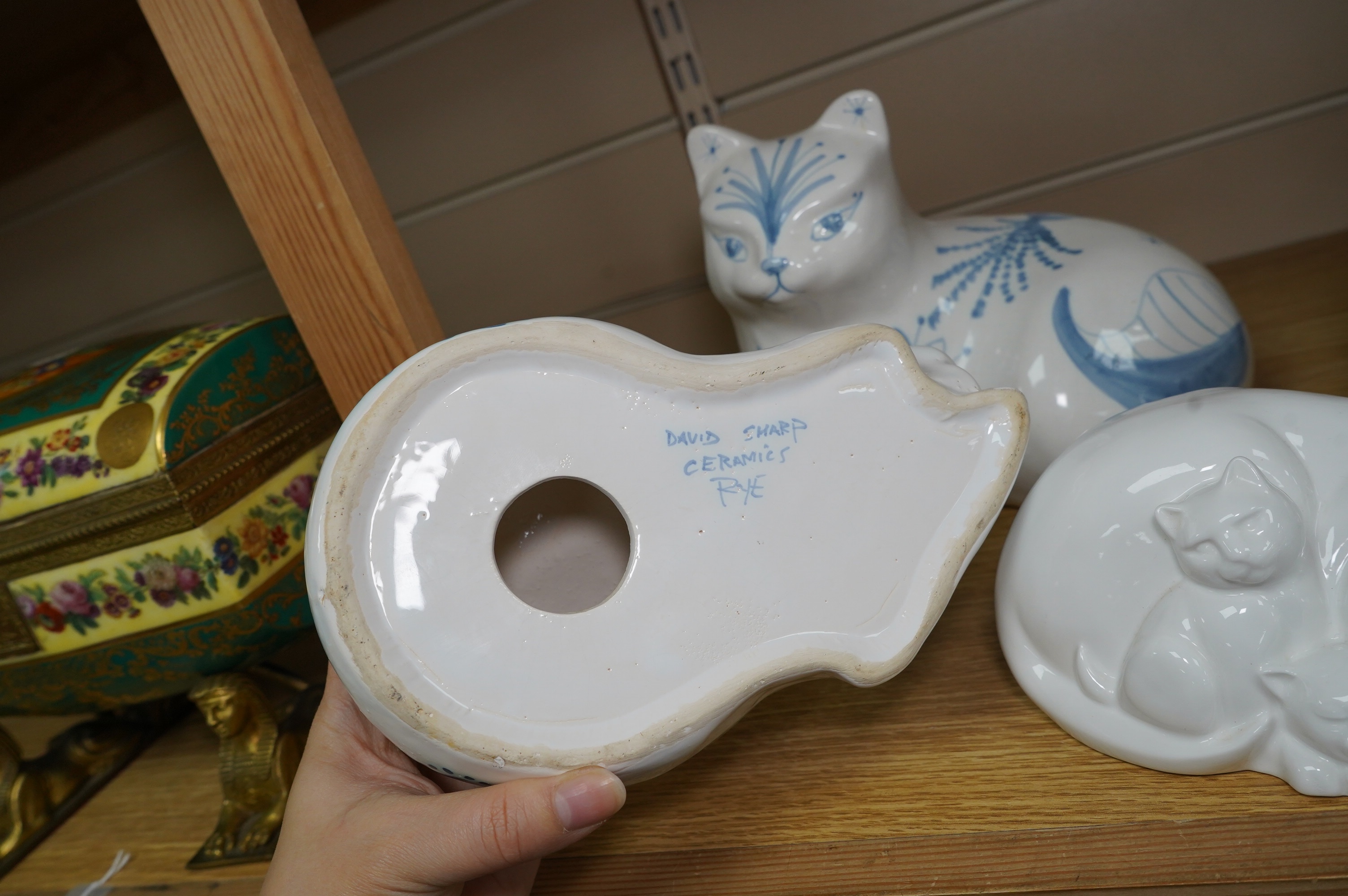 Three large David Sharp Rye pottery models of cats and a Moments by Coalport cat ‘Mothers Love’, tallest 18cm. Condition - largest cat with large firing crack to base otherwise good